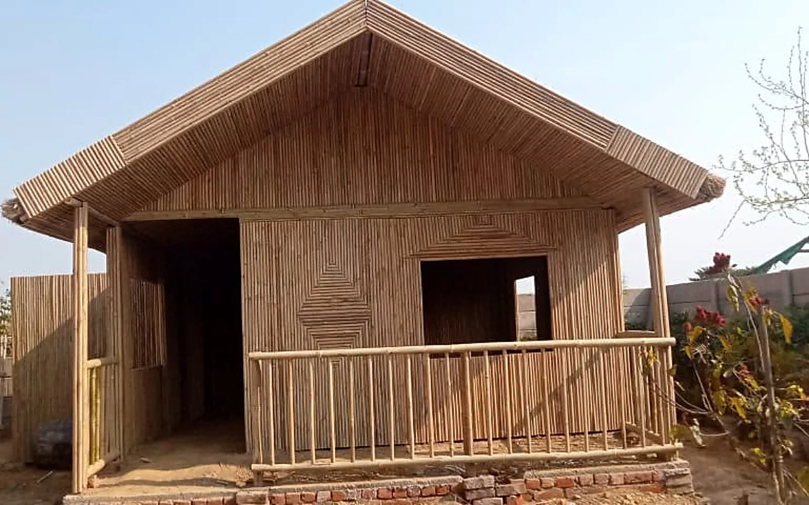 Hand-built bamboo pavilion with a large shaded roof